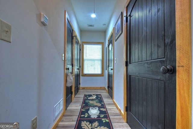 hallway featuring hardwood / wood-style floors