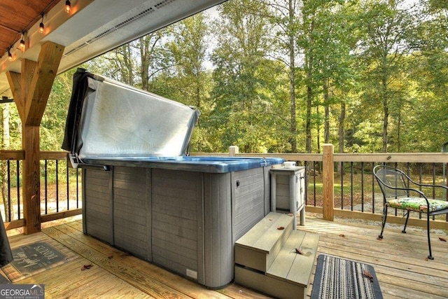 deck featuring a hot tub