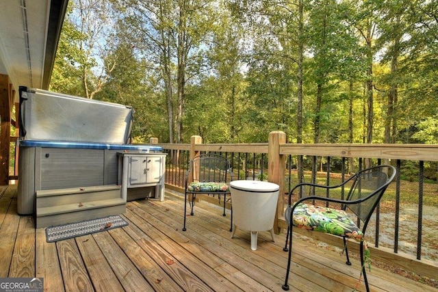 deck with a hot tub