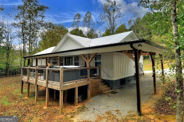 view of side of home with a wooden deck