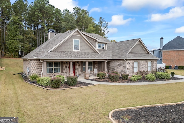 craftsman-style house with a porch and a front lawn