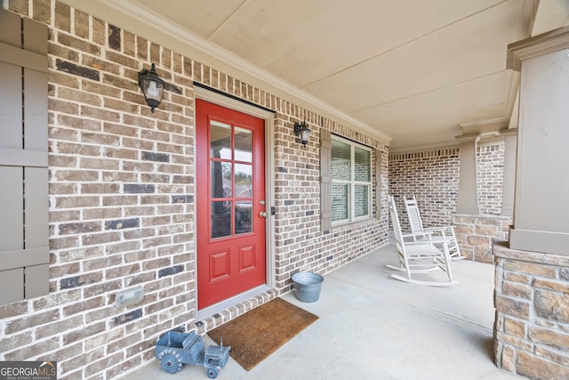 doorway to property with a porch