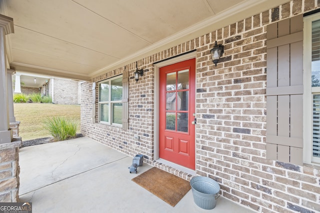 doorway to property with covered porch