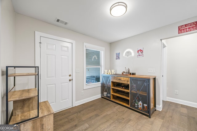 entrance foyer featuring hardwood / wood-style flooring