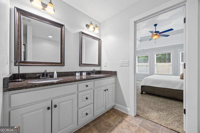 bathroom featuring ceiling fan and vanity