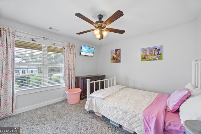 carpeted bedroom with ceiling fan