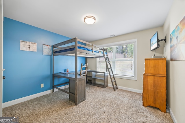 bedroom featuring carpet