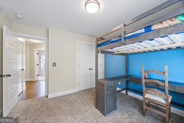 bedroom with carpet flooring and a closet