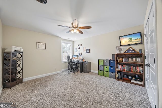 carpeted office with ceiling fan