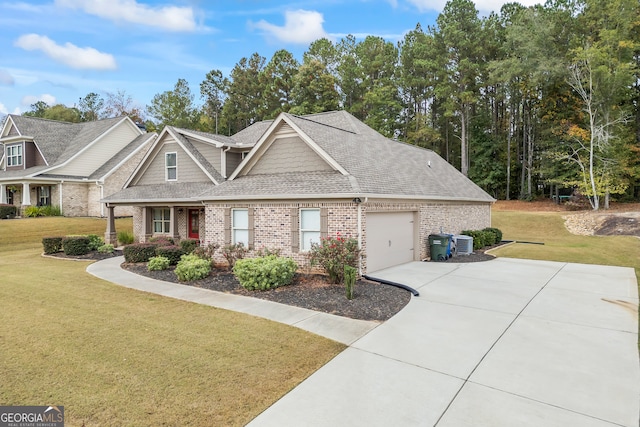 view of front of house featuring a front yard, a garage, and central AC unit