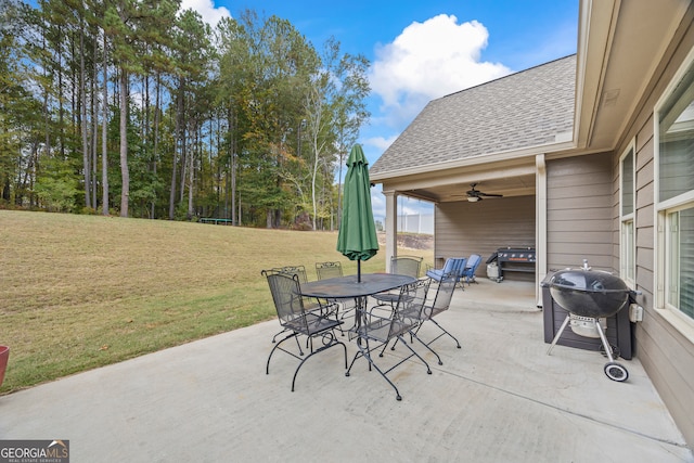 view of patio with ceiling fan and a grill