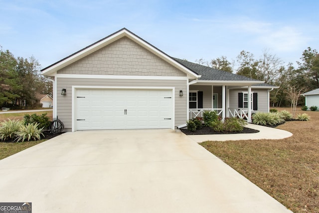 view of front facade featuring a porch and a garage