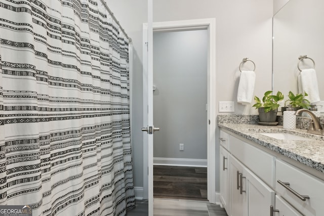 bathroom featuring vanity and wood-type flooring