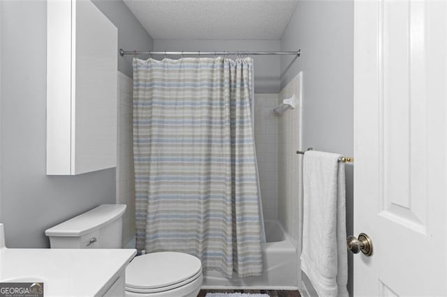 full bathroom featuring vanity, toilet, shower / bathtub combination with curtain, and a textured ceiling