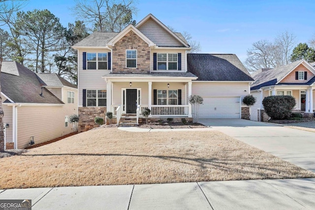 view of front facade featuring covered porch and a garage