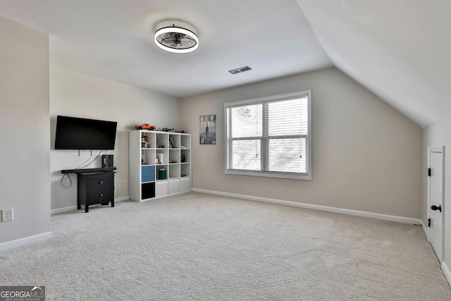 bonus room featuring light carpet and lofted ceiling