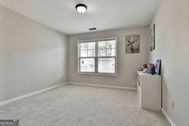 view of carpeted spare room