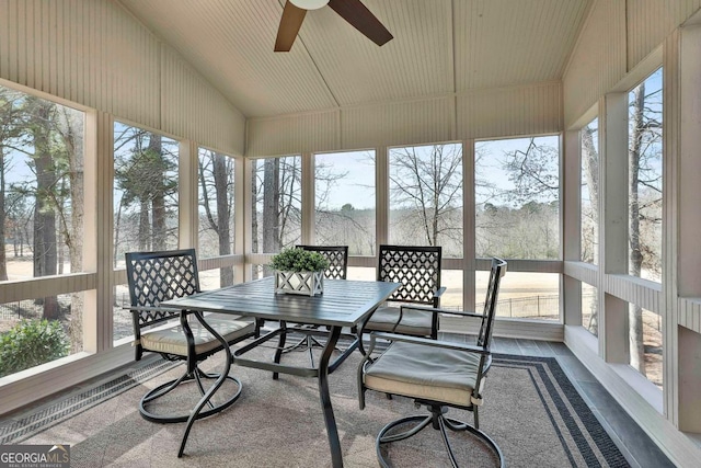 sunroom featuring ceiling fan