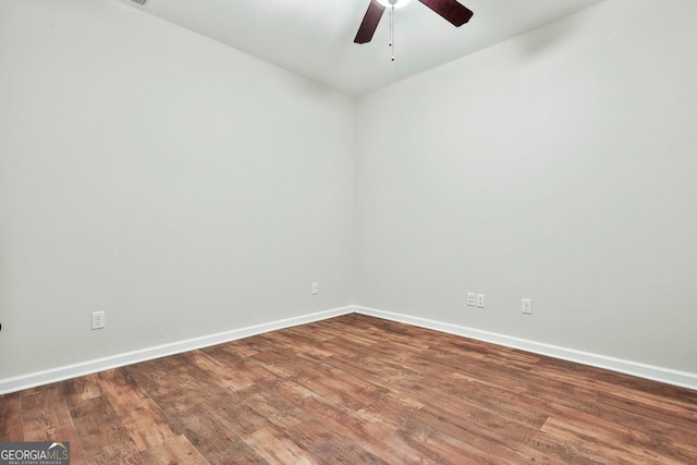 unfurnished room with ceiling fan and hardwood / wood-style flooring