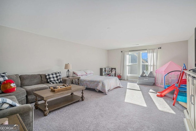 bedroom featuring light colored carpet