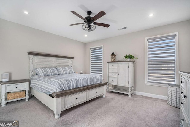 bedroom featuring ceiling fan and light carpet