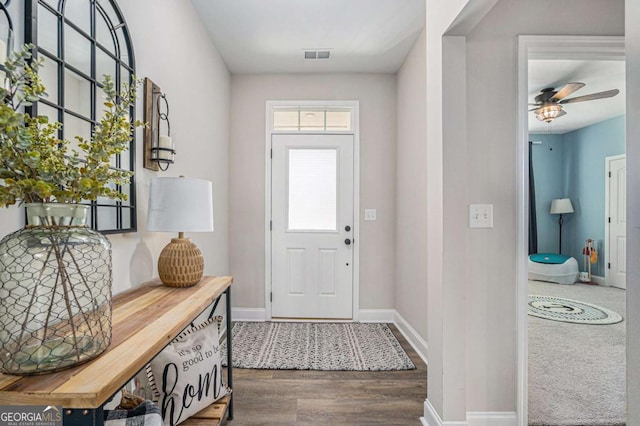 entrance foyer with ceiling fan and hardwood / wood-style flooring