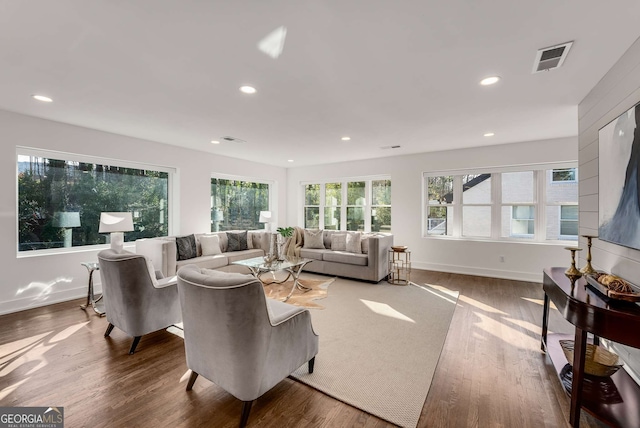 living room with plenty of natural light and wood-type flooring