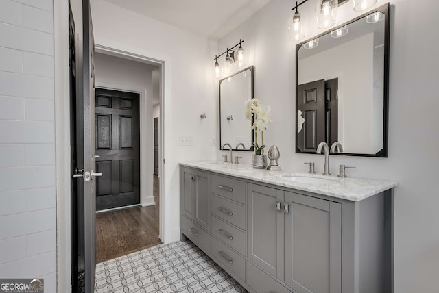 bathroom featuring tile patterned flooring and vanity