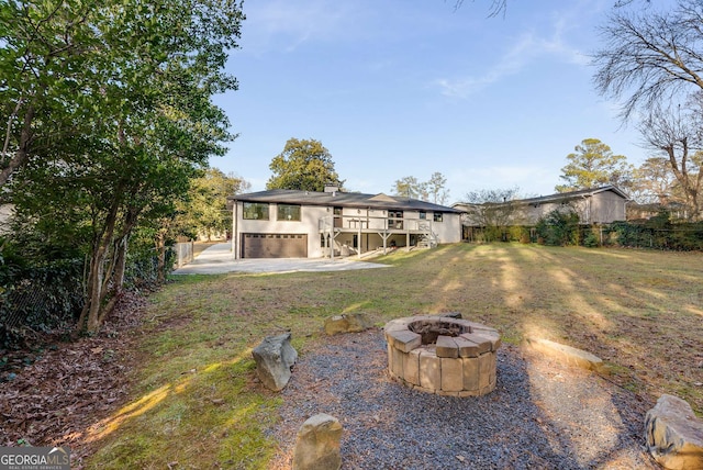 view of yard featuring an outdoor fire pit, a patio area, and a wooden deck