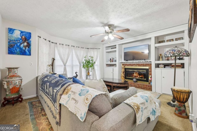 carpeted bedroom featuring ceiling fan, a textured ceiling, and a brick fireplace