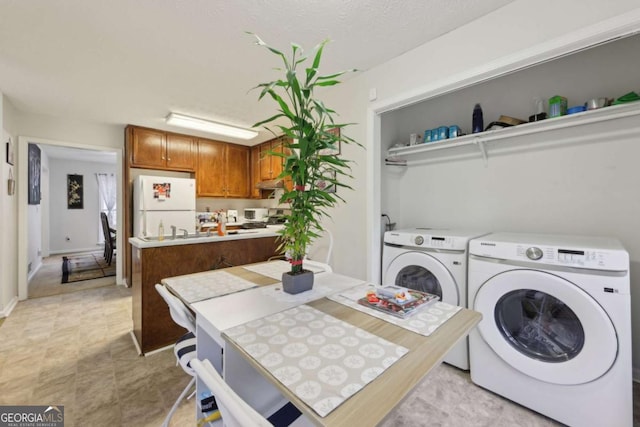 laundry room featuring washing machine and clothes dryer