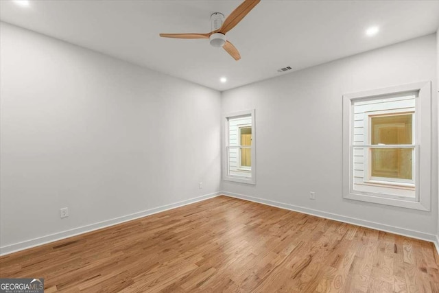 unfurnished room featuring light hardwood / wood-style floors and ceiling fan