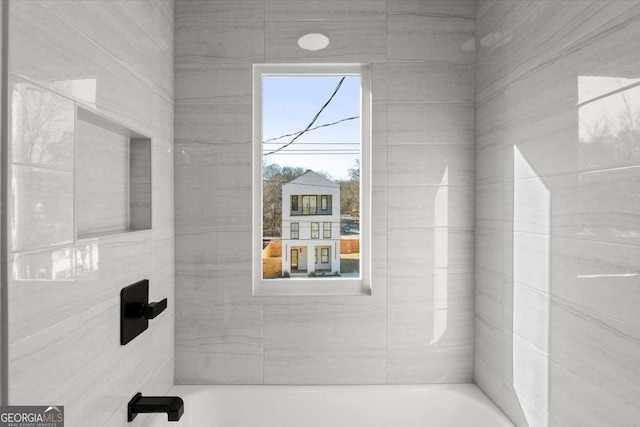 bathroom featuring a tub to relax in