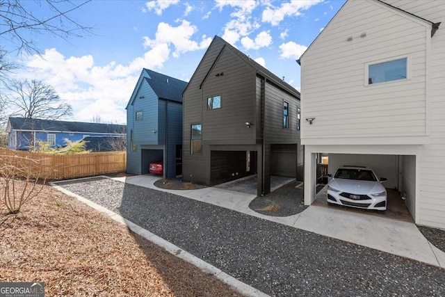 rear view of property featuring a garage