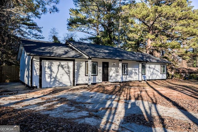 ranch-style home featuring a garage