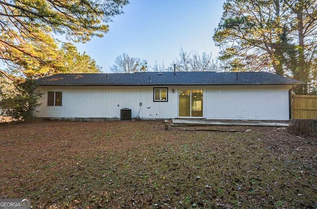 rear view of house with a patio and central AC unit