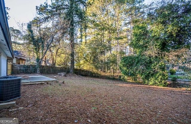 view of yard with a patio and central AC unit