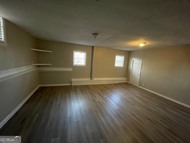 basement with dark wood-type flooring