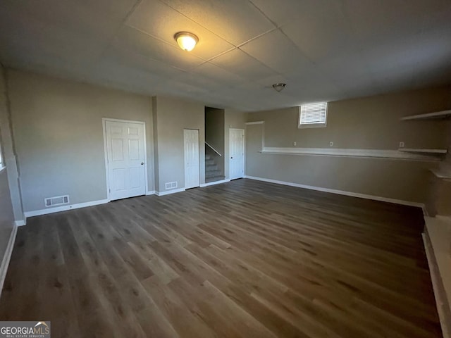 unfurnished bedroom with dark wood-type flooring