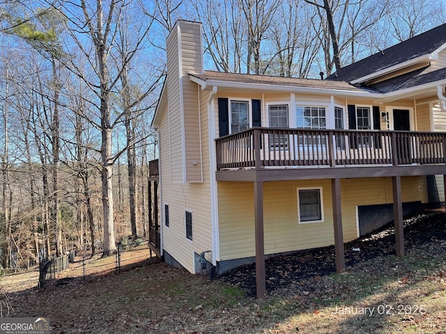 back of property featuring a deck