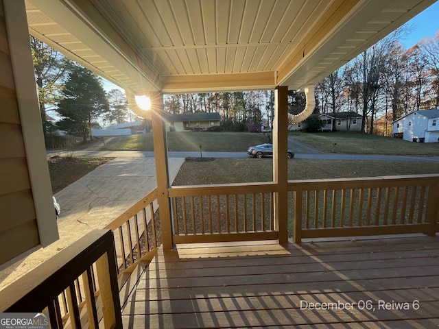 wooden terrace featuring a porch