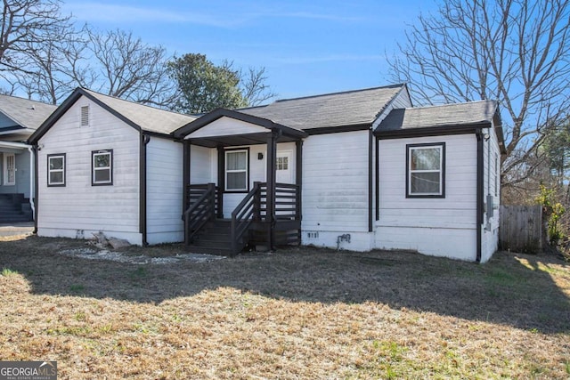 ranch-style home with a front lawn