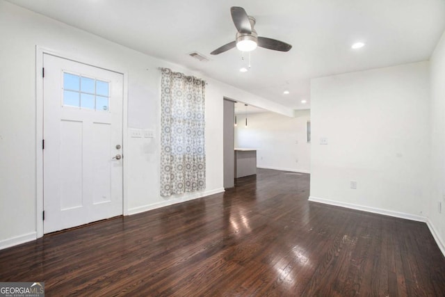 foyer with dark hardwood / wood-style floors and ceiling fan