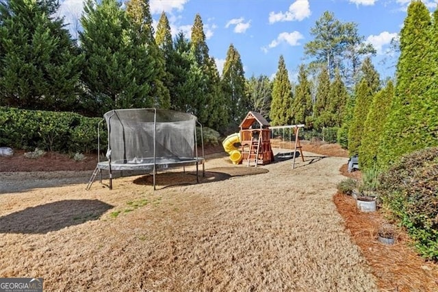 view of jungle gym featuring a trampoline