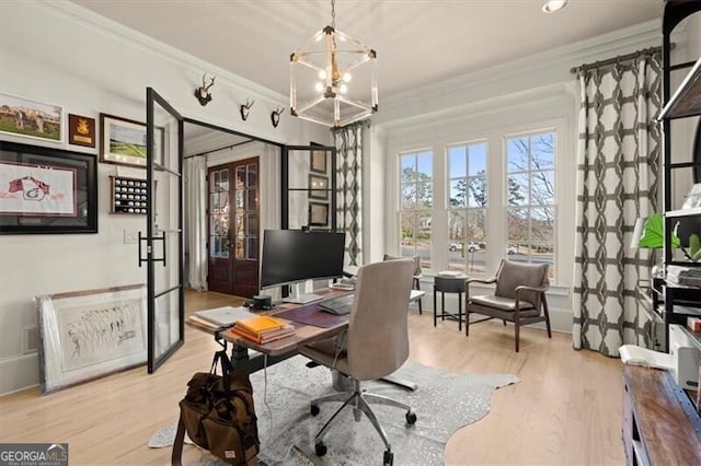 office with french doors, light hardwood / wood-style floors, crown molding, and a notable chandelier