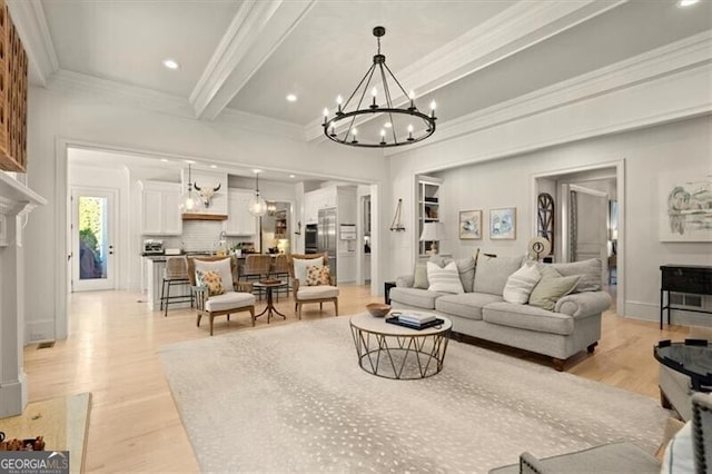 living room featuring beamed ceiling, a notable chandelier, light hardwood / wood-style floors, and ornamental molding