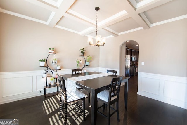 dining room featuring a chandelier, beam ceiling, dark wood-type flooring, and coffered ceiling