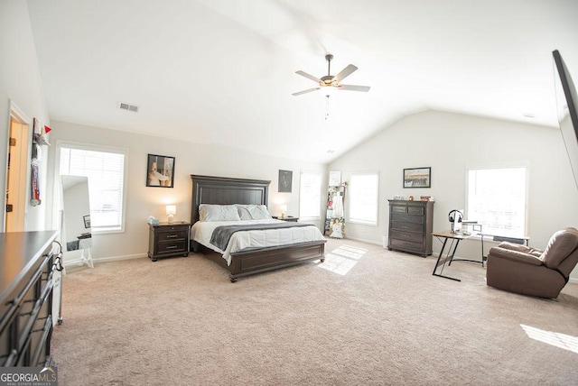 carpeted bedroom featuring vaulted ceiling and ceiling fan