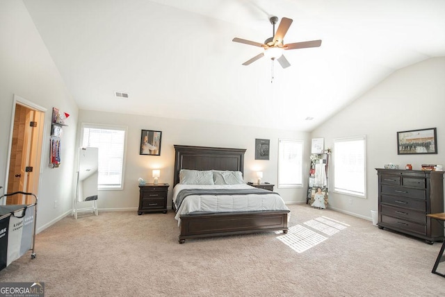 bedroom featuring multiple windows, light carpet, and ceiling fan