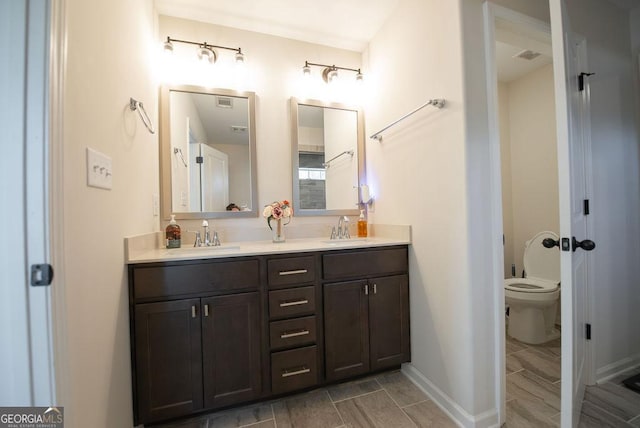 bathroom with vanity and toilet